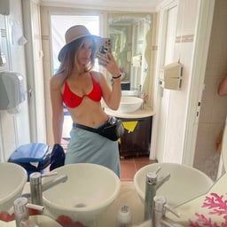 The coquettish lady is lying on the bed and being played with in various ways by her brother